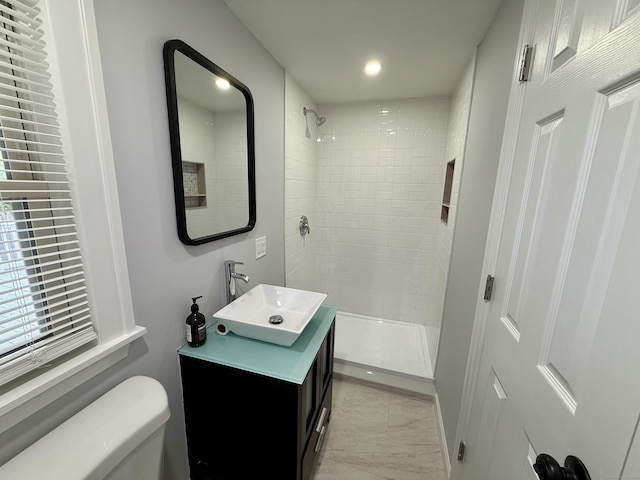 654 Nichols Ave, Stratford, CT 06614 - full bath featuring vanity, a tile shower, marble look tile flooring, and recessed lighting