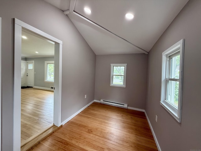 654 Nichols Ave, Stratford, CT 06614 - unfurnished room with a baseboard heating unit, vaulted ceiling, light wood-type flooring, plenty of natural light, and recessed lighting