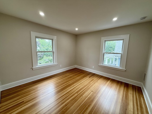 654 Nichols Ave, Stratford, CT 06614 - unfurnished room featuring hardwood / wood-style flooring, a smoke detector, and recessed lighting