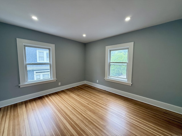 654 Nichols Ave, Stratford, CT 06614 - unfurnished room with wood finished floors and recessed lighting