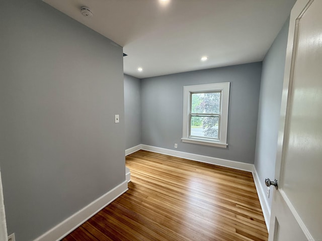 654 Nichols Ave, Stratford, CT 06614 - unfurnished room with wood finished floors, a smoke detector, and recessed lighting