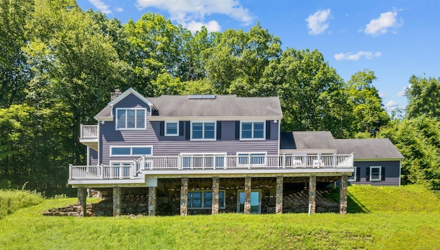 168 Cobble Rd, Kent, CT 06757 - rear view of house featuring a chimney, a lawn, a wooden deck, and stone siding