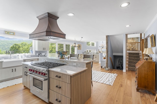 168 Cobble Rd, Kent, CT 06757 - kitchen with premium stove, island exhaust hood, a chandelier, light wood-type flooring, and recessed lighting