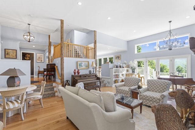 168 Cobble Rd, Kent, CT 06757 - living area featuring a chandelier, stairs, recessed lighting, light wood-style flooring, and a high ceiling