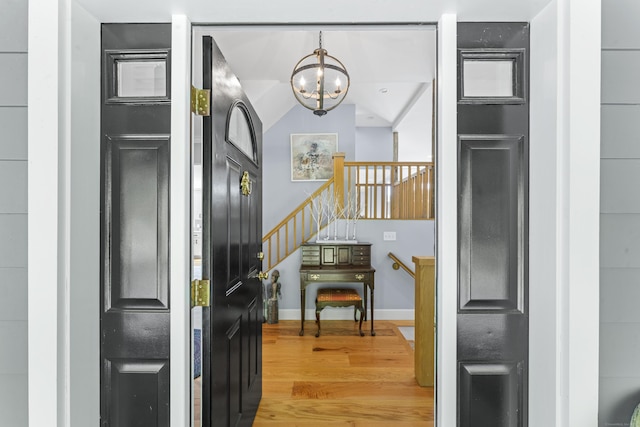 168 Cobble Rd, Kent, CT 06757 - entrance foyer with light wood-style flooring and a chandelier
