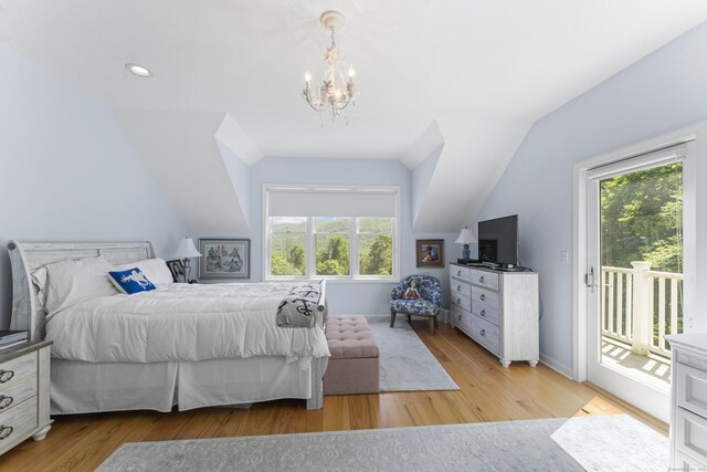 168 Cobble Rd, Kent, CT 06757 - bedroom featuring access to exterior, multiple windows, lofted ceiling, a chandelier, and wood finished floors