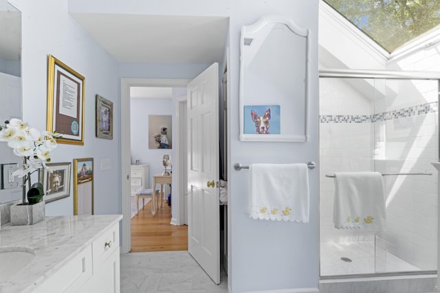 168 Cobble Rd, Kent, CT 06757 - full bath with vanity, marble look tiles, and a stall shower