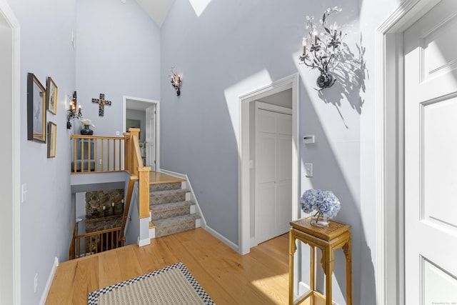 168 Cobble Rd, Kent, CT 06757 - foyer featuring light wood-style flooring, stairway, and high vaulted ceiling