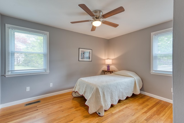 226 Farm Hill Rd, Middletown, CT 06457 - bedroom with multiple windows, wood finished floors, and ceiling fan