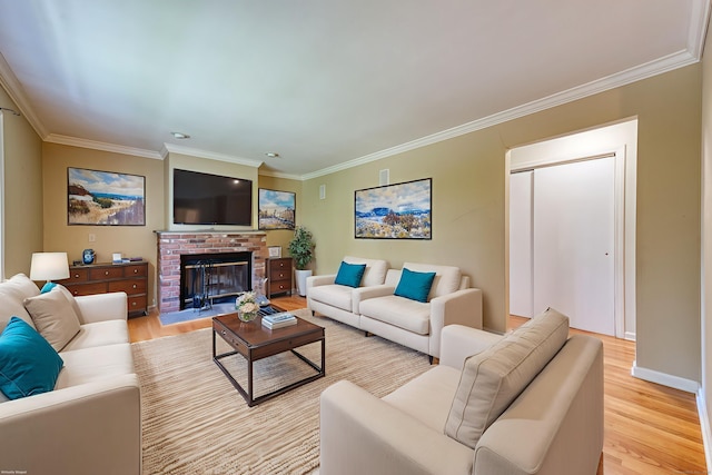 20 Copper Hill Dr Unit 20, Guilford, CT 06437 - living area featuring ornamental molding, light wood-style flooring, and a brick fireplace