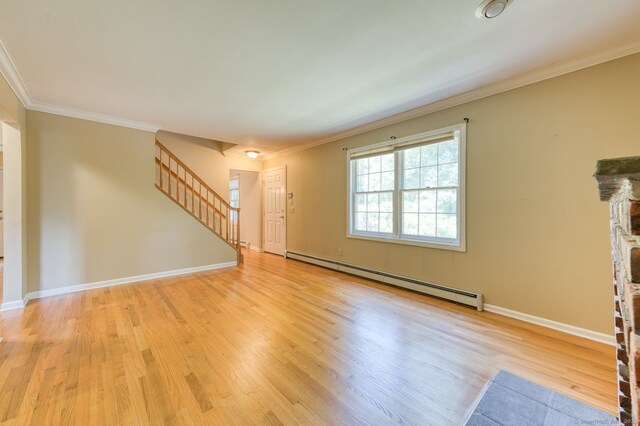 20 Copper Hill Dr Unit 20, Guilford, CT 06437 - unfurnished living room with a baseboard radiator, stairway, light wood-type flooring, ornamental molding, and a fireplace