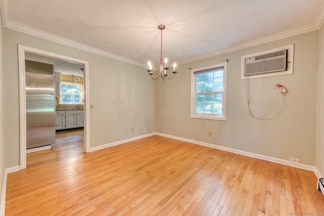 20 Copper Hill Dr Unit 20, Guilford, CT 06437 - unfurnished room featuring a wall unit AC, healthy amount of natural light, a chandelier, ornamental molding, and light wood-type flooring