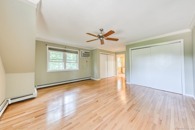 20 Copper Hill Dr Unit 20, Guilford, CT 06437 - unfurnished bedroom featuring baseboard heating, a wall mounted AC, hardwood / wood-style flooring, multiple closets, and ornamental molding