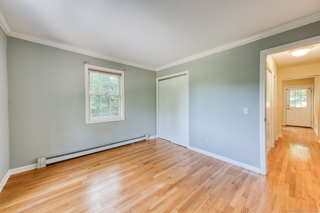 20 Copper Hill Dr Unit 20, Guilford, CT 06437 - empty room featuring baseboard heating, light wood-style floors, plenty of natural light, and ornamental molding