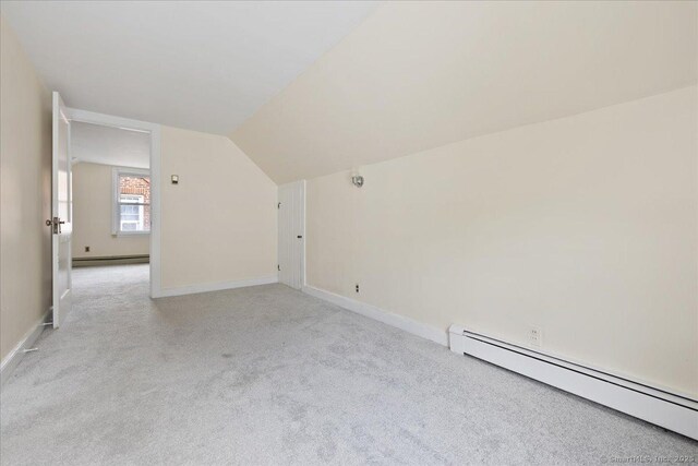 30 Cedar Crest Pl, Norwalk, CT 06854 - bonus room with a baseboard heating unit, light carpet, and vaulted ceiling