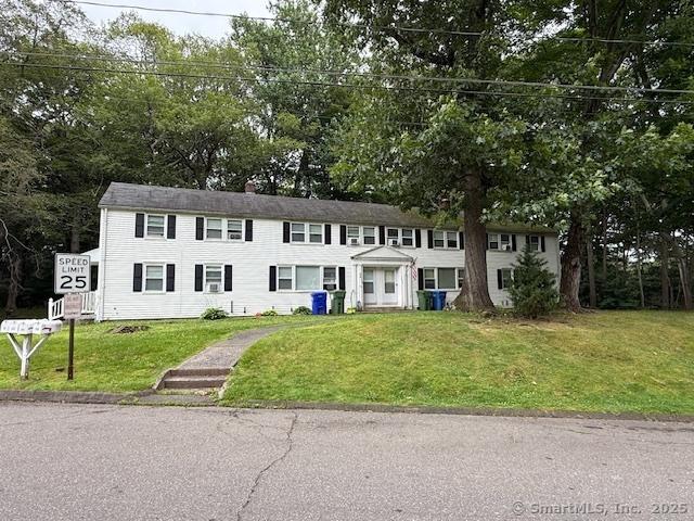 131 N Ridgeland Rd, Wallingford, CT 06492 - view of front of house featuring a front yard and view of wooded area