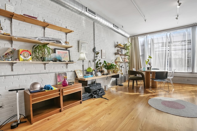 817 Grand Ave Unit 202, New Haven, CT 06511 - office area featuring wood finished floors and brick wall