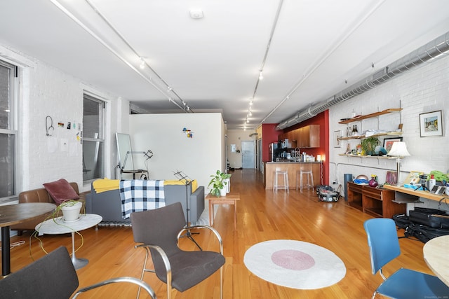 817 Grand Ave Unit 202, New Haven, CT 06511 - living room with light wood-style flooring and brick wall