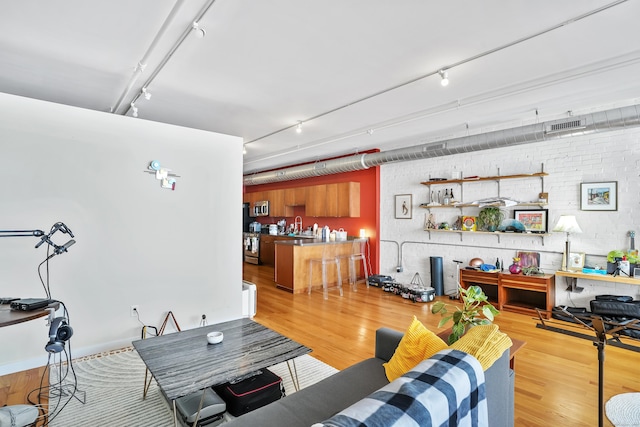 817 Grand Ave Unit 202, New Haven, CT 06511 - living area with rail lighting, wood finished floors, and wet bar