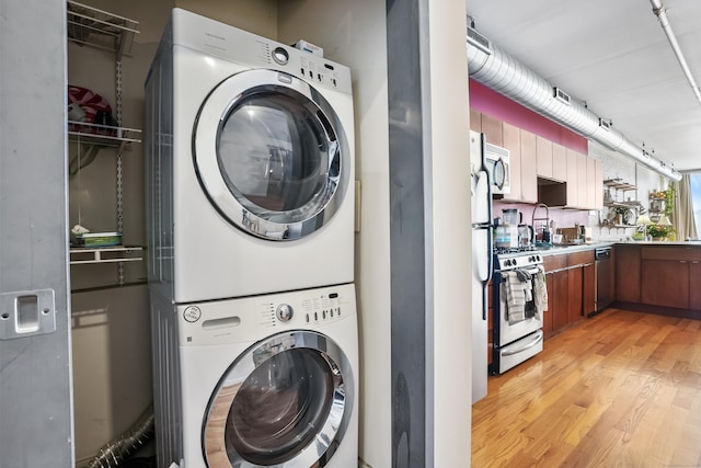 817 Grand Ave Unit 202, New Haven, CT 06511 - laundry area with estacked washer and dryer and light wood-type flooring