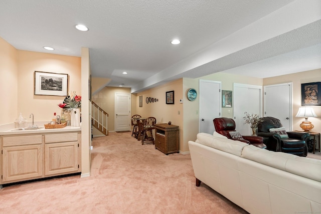 living room featuring light carpet, stairway, and recessed lighting