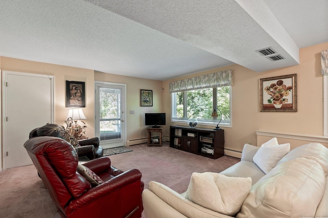 living room featuring carpet, plenty of natural light, a baseboard heating unit, and a textured ceiling