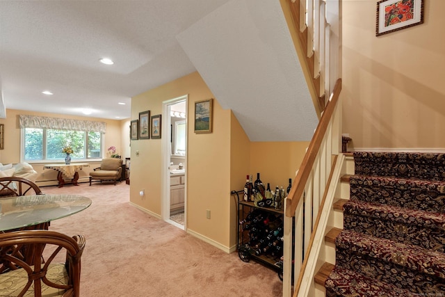 stairway featuring carpet flooring and recessed lighting