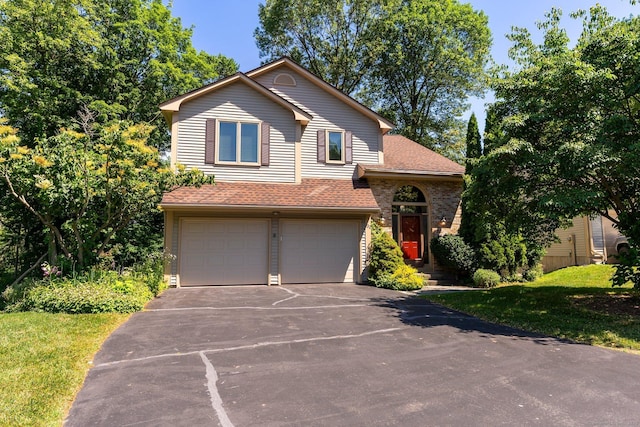 view of front of house featuring driveway, a garage, a shingled roof, and brick siding