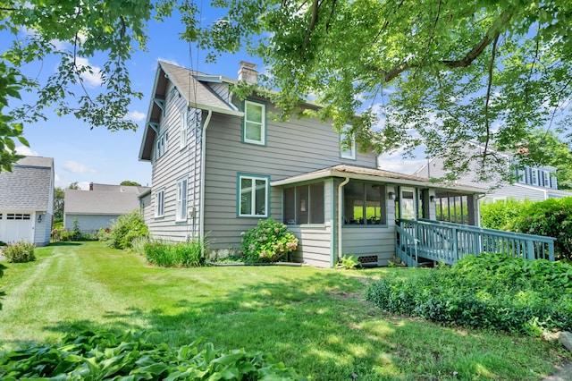 159 Jefferson St, Stratford, CT 06615 - back of house featuring a sunroom, a chimney, and a yard