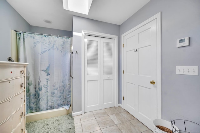159 Jefferson St, Stratford, CT 06615 - full bath featuring a closet, a shower with curtain, tile patterned flooring, and a skylight