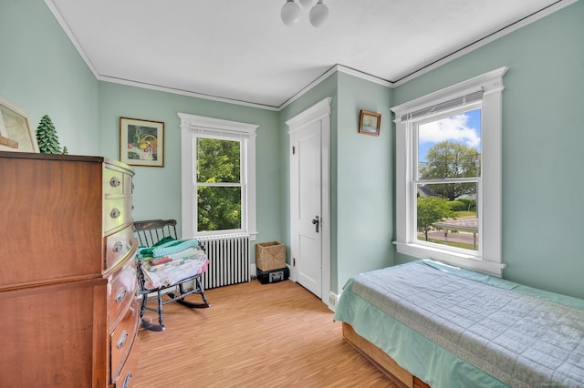 159 Jefferson St, Stratford, CT 06615 - bedroom with radiator heating unit, light wood finished floors, and crown molding