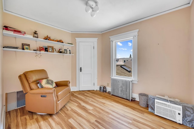 159 Jefferson St, Stratford, CT 06615 - sitting room featuring radiator, wood finished floors, and ornamental molding