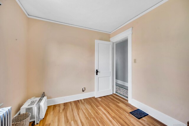 159 Jefferson St, Stratford, CT 06615 - spare room with crown molding and light wood-style floors