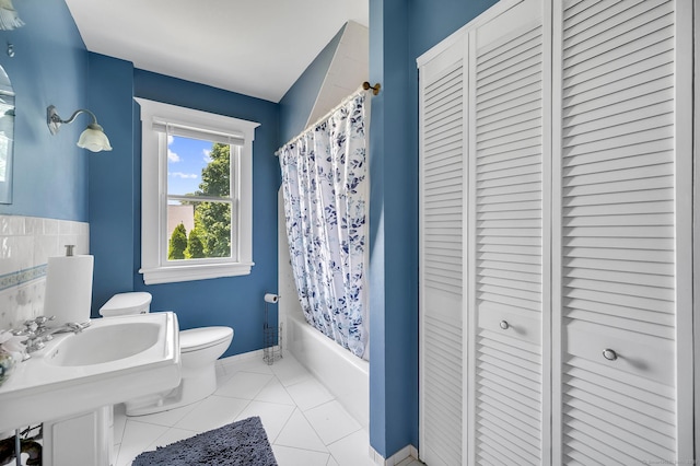 159 Jefferson St, Stratford, CT 06615 - bathroom featuring a closet, shower / bath combo with shower curtain, and tile patterned floors