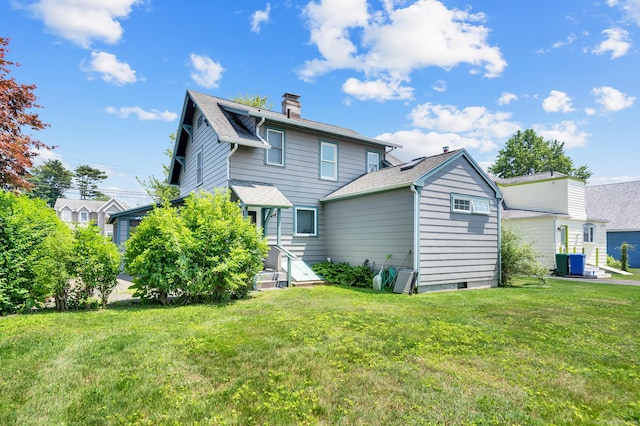 159 Jefferson St, Stratford, CT 06615 - rear view of property featuring a chimney, a lawn, and a shingled roof