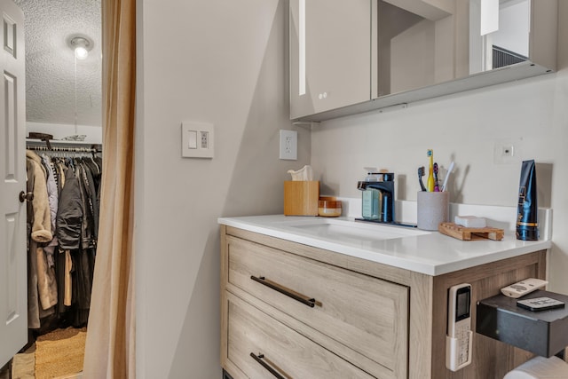 323 Carriage Crossing Ln Unit 323, Middletown, CT 06457 - kitchen featuring a textured ceiling and light countertops