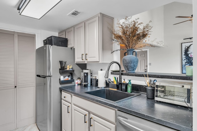 323 Carriage Crossing Ln Unit 323, Middletown, CT 06457 - kitchen with stainless steel appliances, dark countertops, and white cabinetry