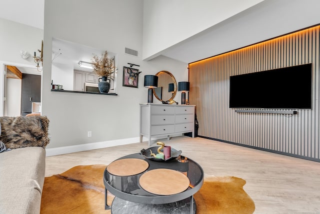 323 Carriage Crossing Ln Unit 323, Middletown, CT 06457 - living room featuring wood finished floors and a towering ceiling