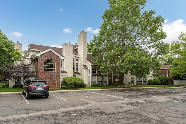 323 Carriage Crossing Ln Unit 323, Middletown, CT 06457 - view of front of home with brick siding and uncovered parking