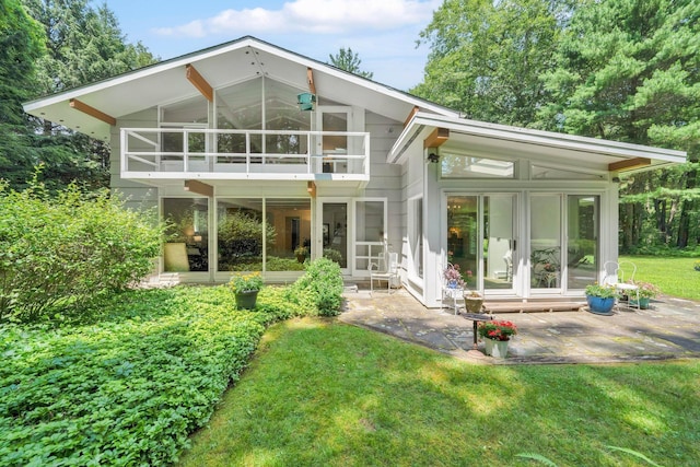 12 Twin Ponds Dr, Farmington, CT 06085 - back of house with a sunroom, a patio area, and a lawn