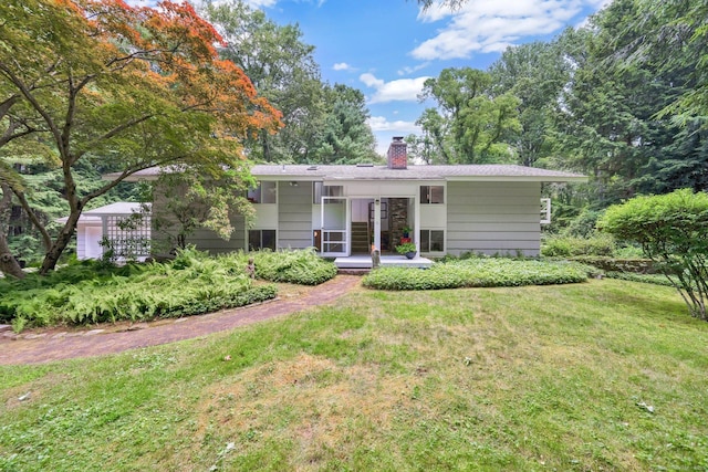 12 Twin Ponds Dr, Farmington, CT 06085 - ranch-style house featuring a chimney, a front yard, and french doors