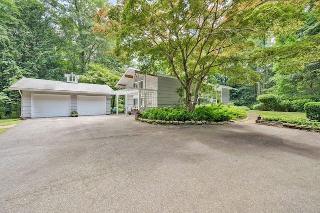 12 Twin Ponds Dr, Farmington, CT 06085 - view of front of house with a detached garage and an outbuilding