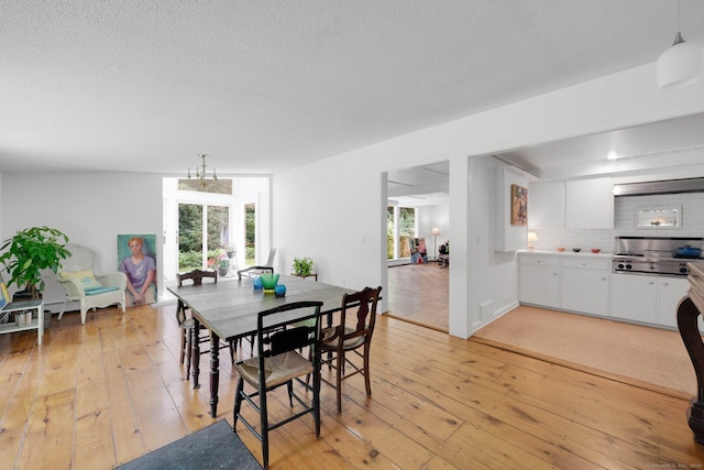 12 Twin Ponds Dr, Farmington, CT 06085 - dining room with light wood-type flooring and a textured ceiling