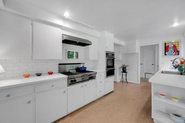 12 Twin Ponds Dr, Farmington, CT 06085 - kitchen with black oven, stainless steel gas cooktop, premium range hood, a warming drawer, and light flooring