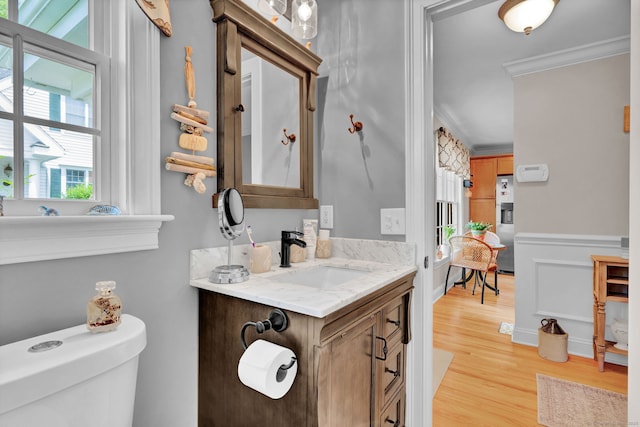 6 Augusta Cir Unit 6, East Haddam, CT 06469 - bathroom featuring crown molding, vanity, wood finished floors, and wainscoting