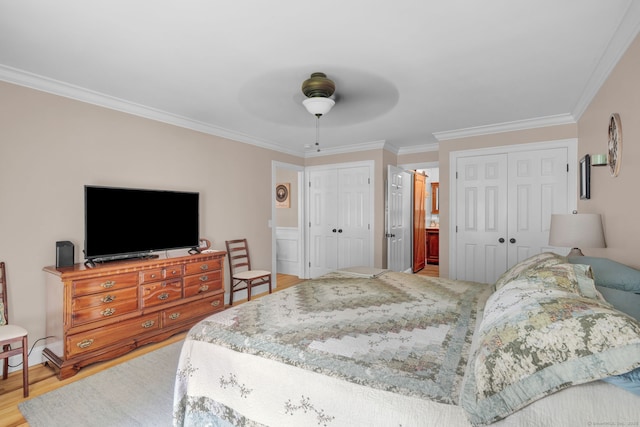 6 Augusta Cir Unit 6, East Haddam, CT 06469 - bedroom with multiple closets, ornamental molding, light wood-style floors, and a ceiling fan