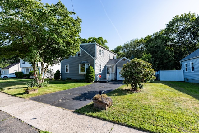 302 E Pasadena Pl, Bridgeport, CT 06610 - view of front of house with driveway and a garage