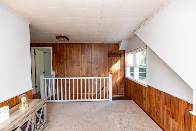 302 E Pasadena Pl, Bridgeport, CT 06610 - corridor featuring wooden walls, carpet flooring, and ornamental molding