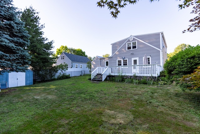 302 E Pasadena Pl, Bridgeport, CT 06610 - back of property with a storage shed and a wooden deck