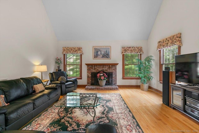 92 Tyler City Rd, Orange, CT 06477 - living room featuring wood finished floors, high vaulted ceiling, healthy amount of natural light, and a brick fireplace